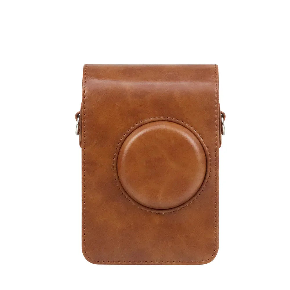 Retro camera storage case with curved shoulder strap in solid colour options including black skin feeling material