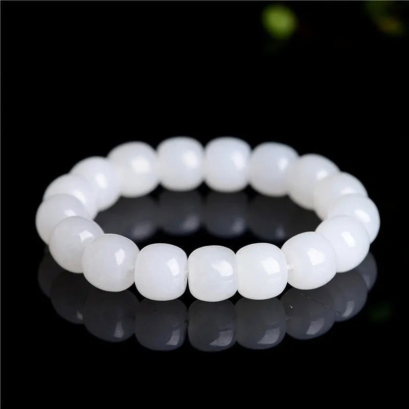 White jade barrel bead bracelet showing Hetian jade construction with traditional barrel beads