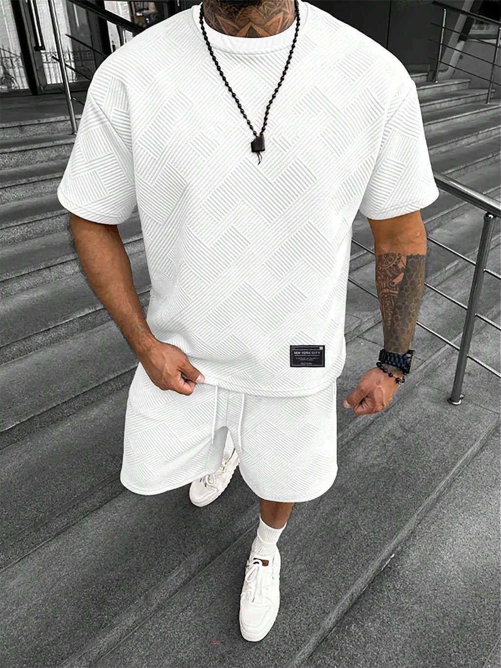 Men's short sleeve top and shorts suit in a polyester blend fabric on a mannequin