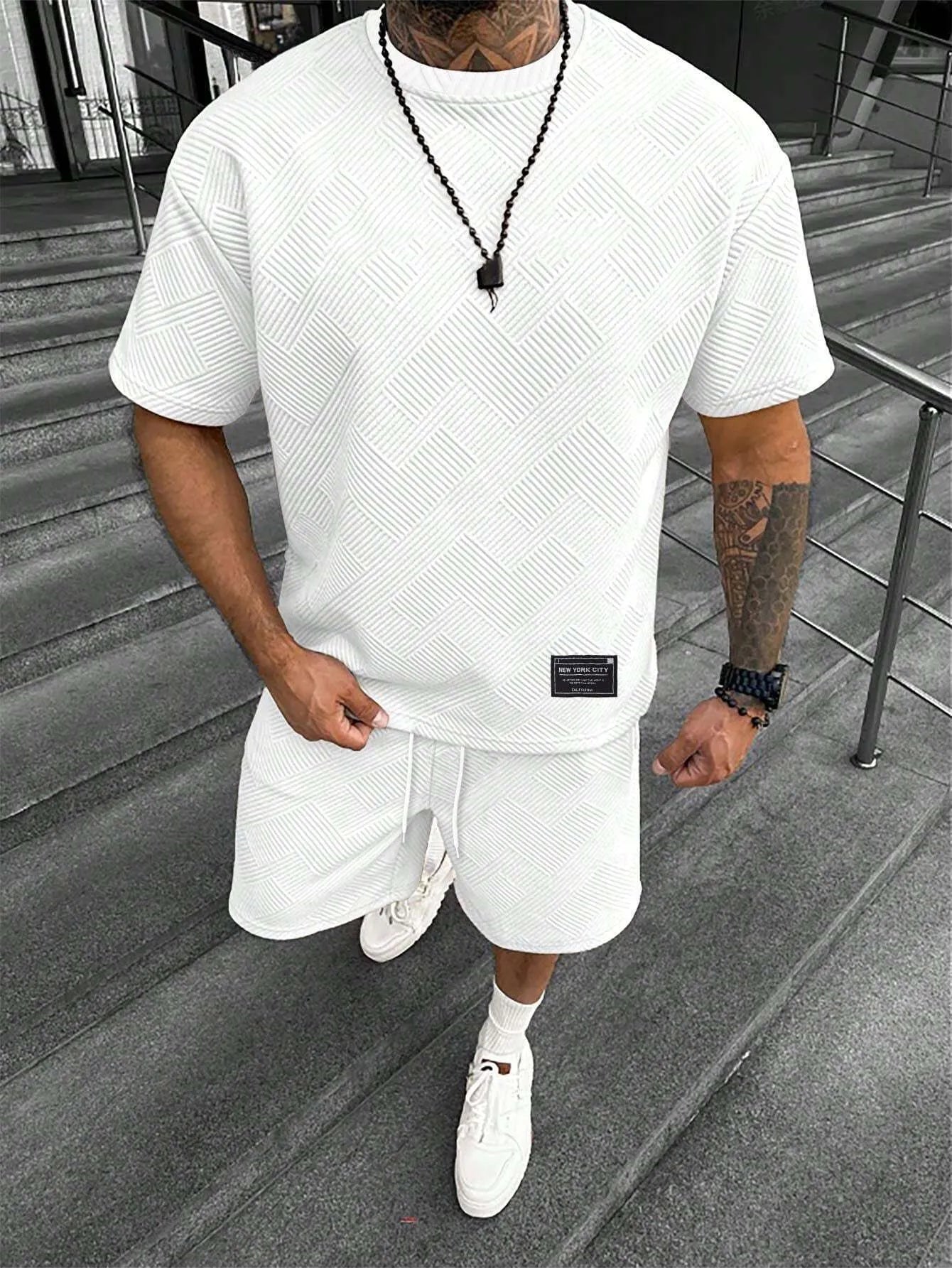 Men's short sleeve top and shorts suit in a polyester blend fabric on a mannequin