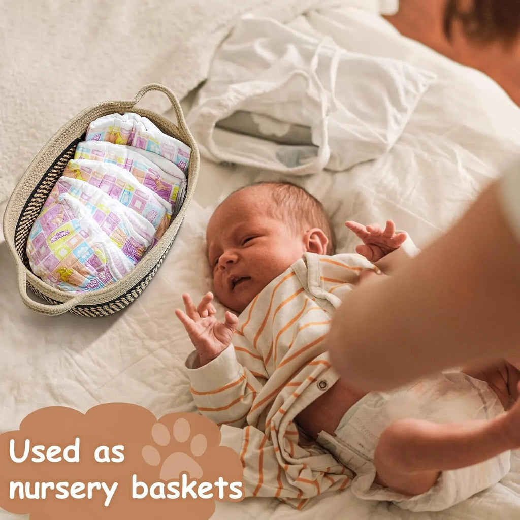 Small light beige woven cotton rope storage basket with a handle on a wooden surface