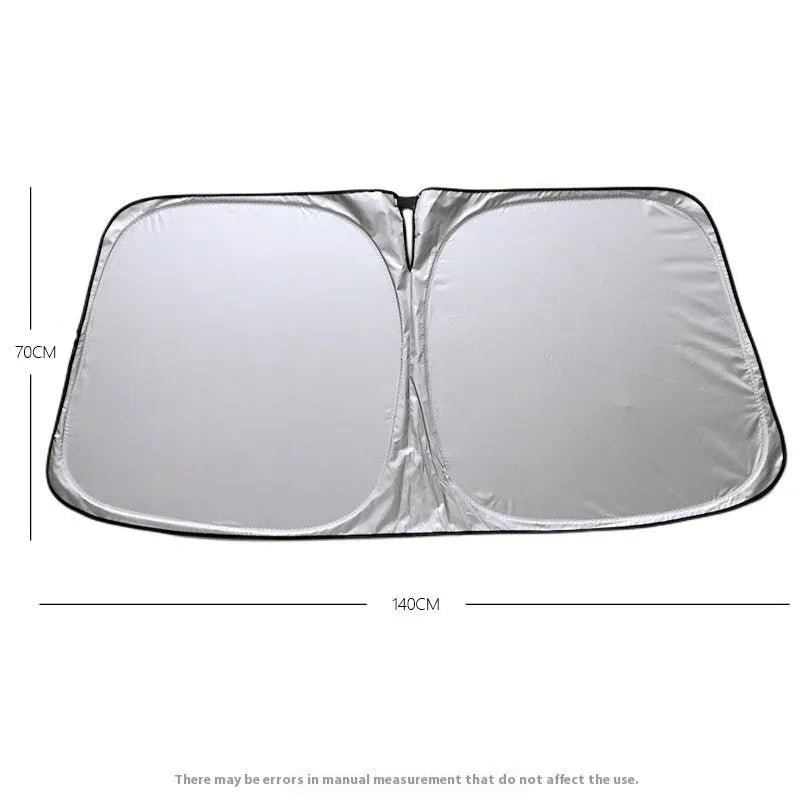 Titanium silver aluminium foil car sunshade folded, showing its reflective surface.