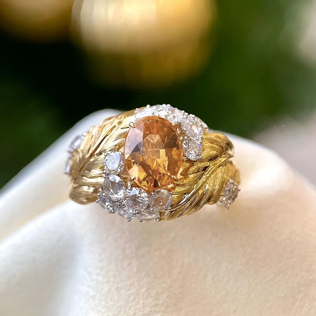 Women's gold copper ring with embossed feather pattern and yellow zircon stones