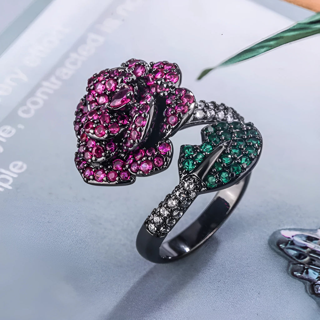 Geometric black gold flower ring with simulated red corundum centre stone