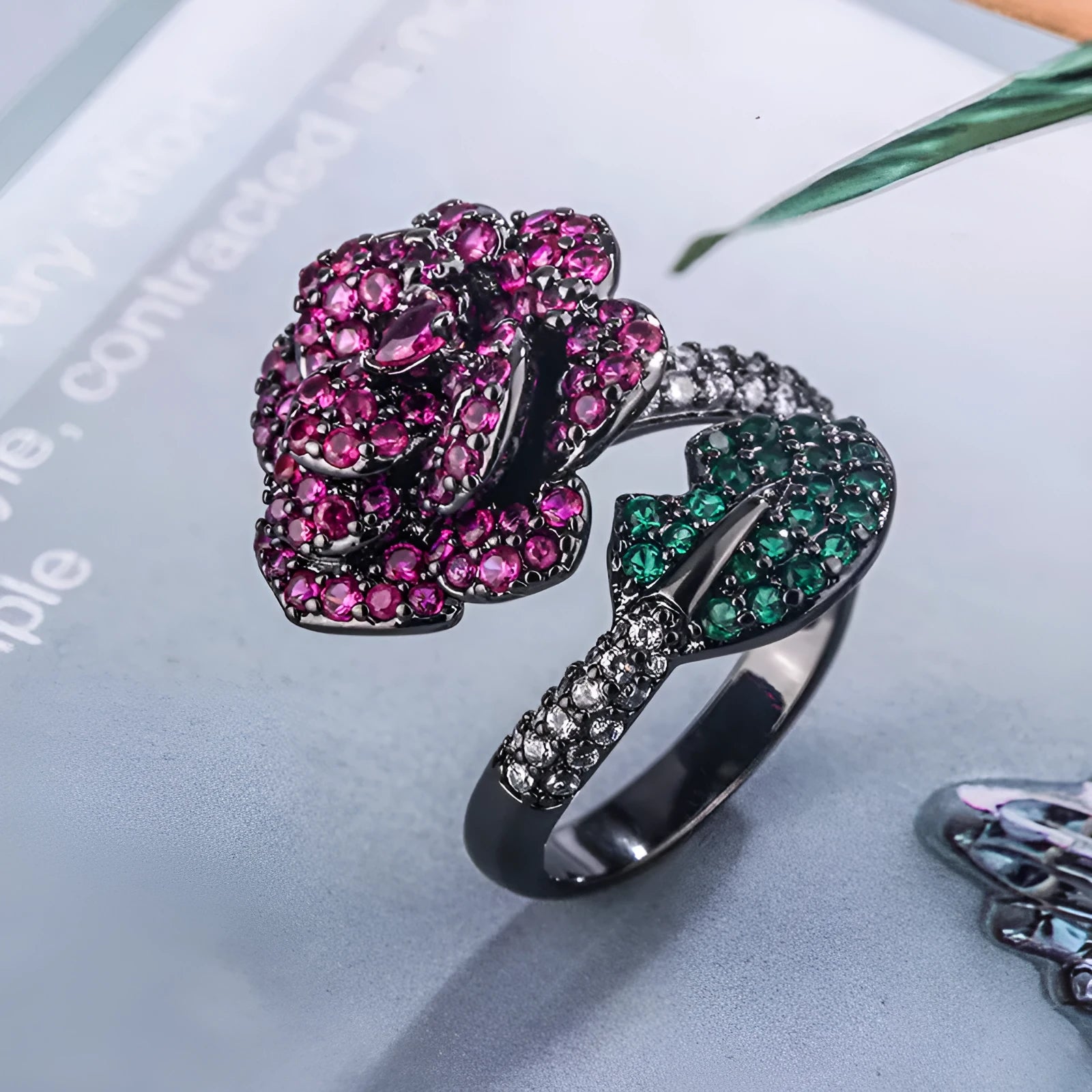 Geometric black gold flower ring with simulated red corundum centre stone