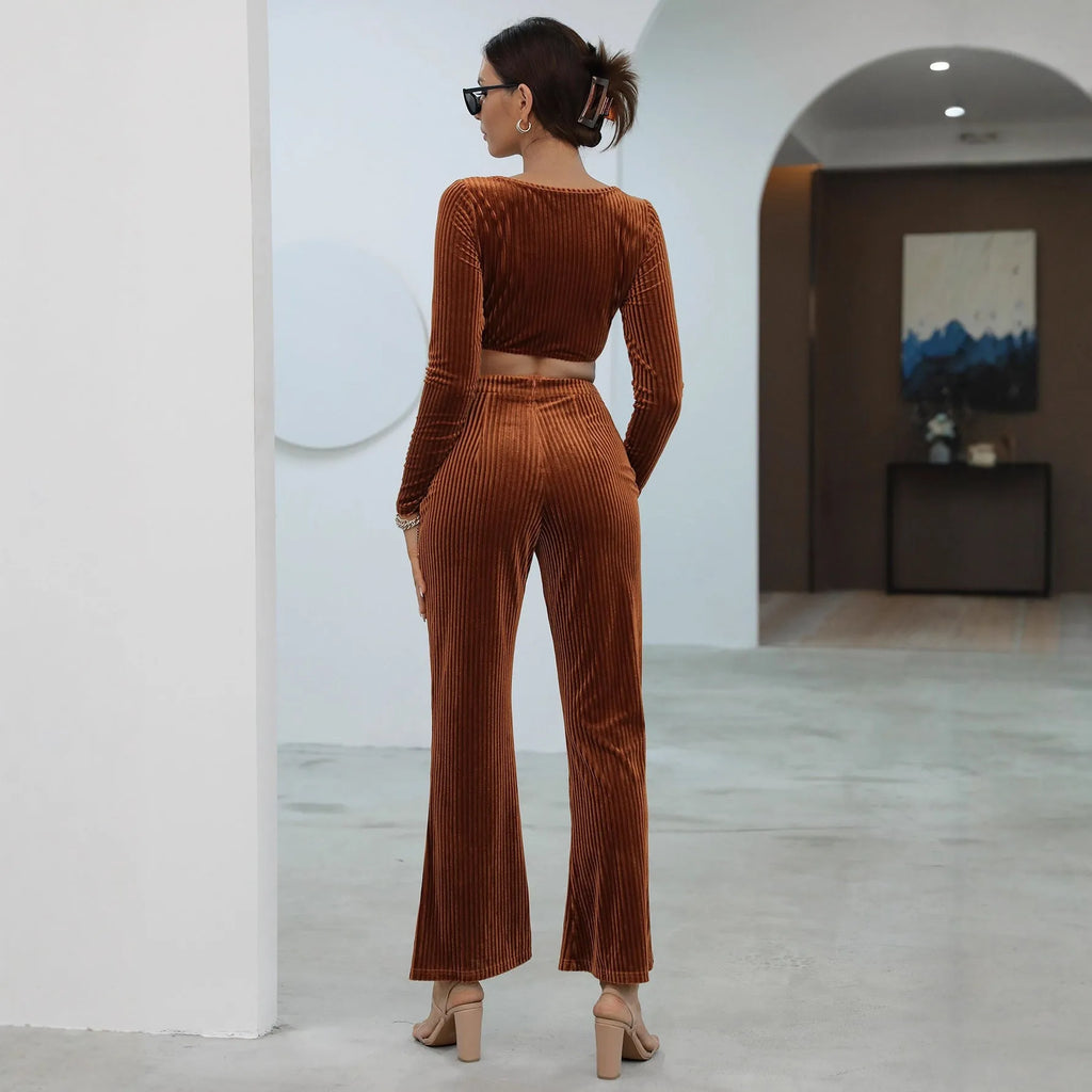 Caramel coloured long sleeve sweater and trouser casual set on a hanger.