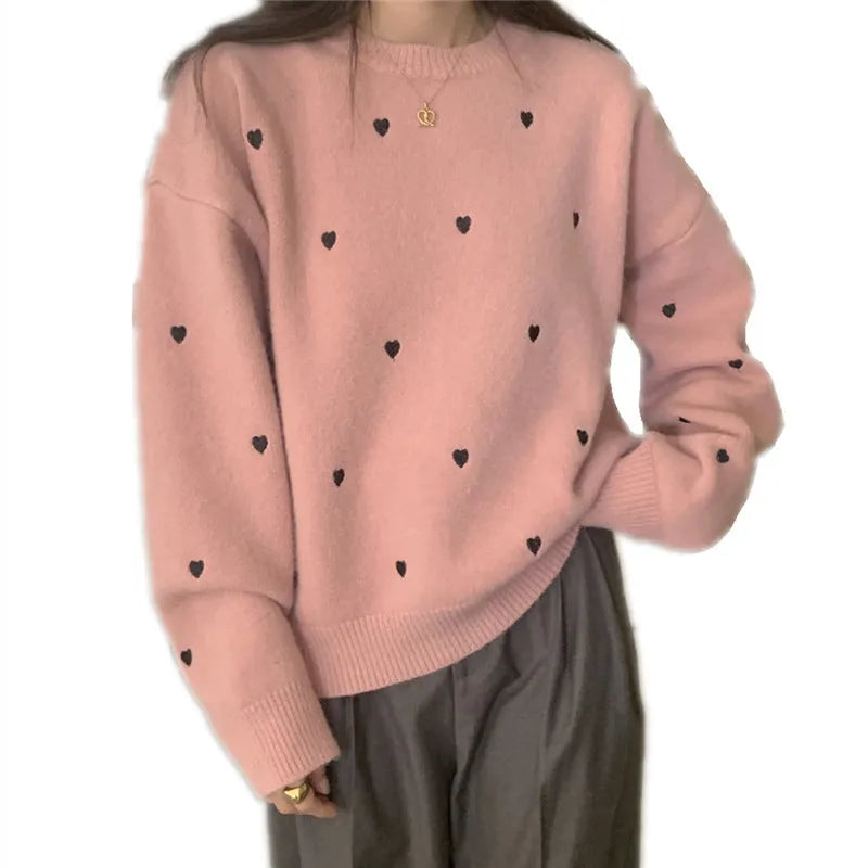 Women's loose long sleeve pink sweater with embroidered love pattern detail