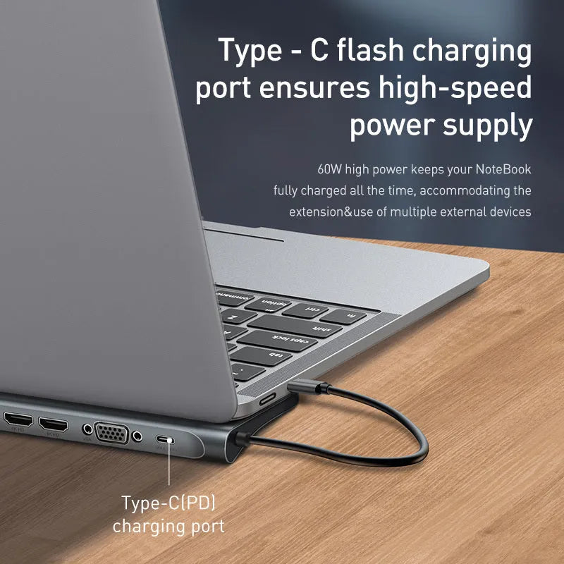 Grey 10-port USB-C docking station with aluminium cooling bracket showing HDMI, VGA, and Ethernet ports