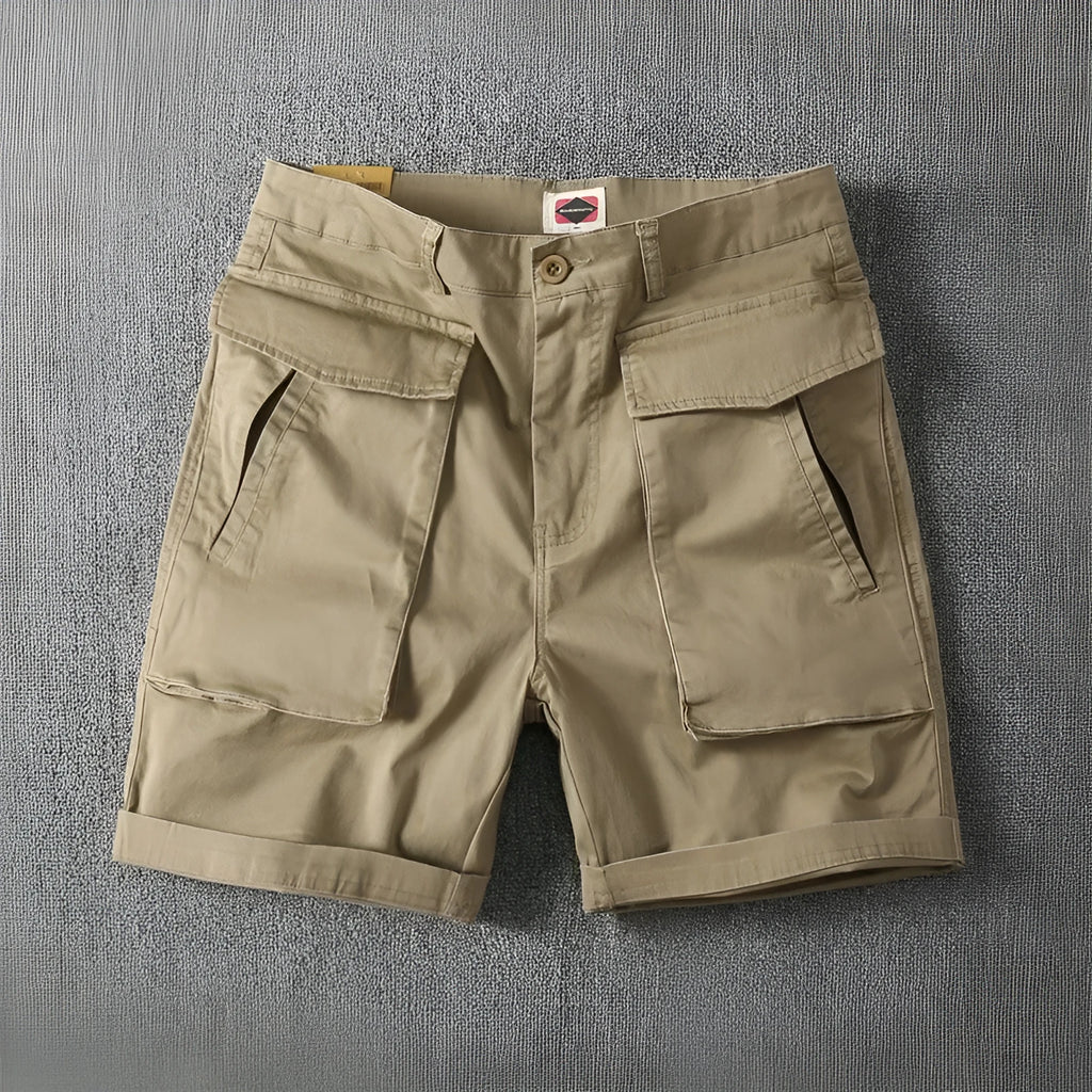 Men's straight-leg cargo shorts in stretch cotton fabric, shown in a neutral colour with multiple pockets.