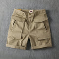 Men's straight-leg cargo shorts in stretch cotton fabric, shown in a neutral colour with multiple pockets.