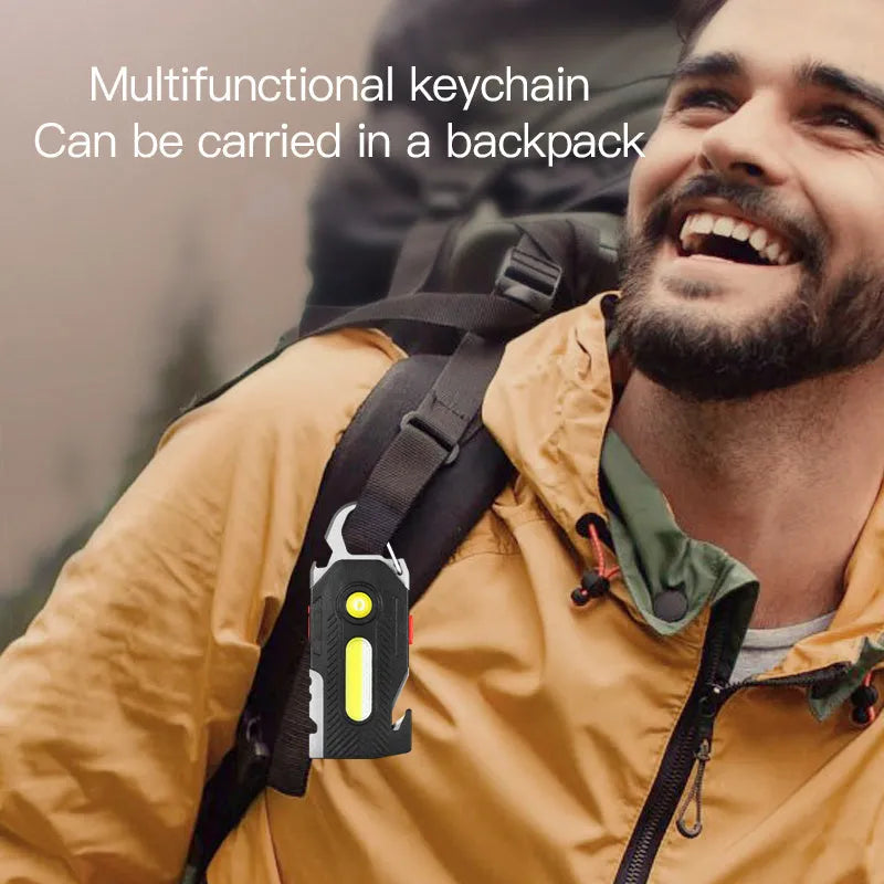Multifunctional charging emergency light with COB high brightness, mountaineering buckle, and bottle opener on a keychain
