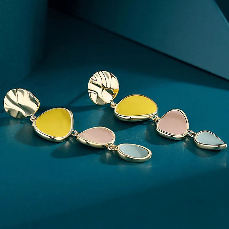 Sterling silver finish Morandi three-colour drip oil wafer disc earrings.