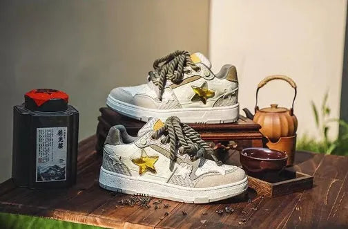 Green low-top casual shoes with star pattern detail and a thick rubber sole