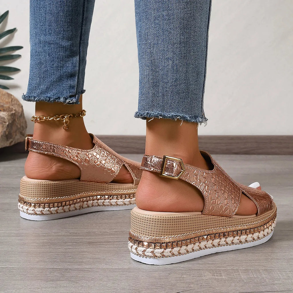 Gold Roman sandals with round toe, hollow-out pattern and adjustable ankle buckle