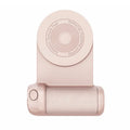 Black magnetic phone camera grip holder with rotatable bracket on a table.