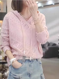 Women's light blue crochet knit hooded longsuit undershirt with long sleeves, laid flat.
