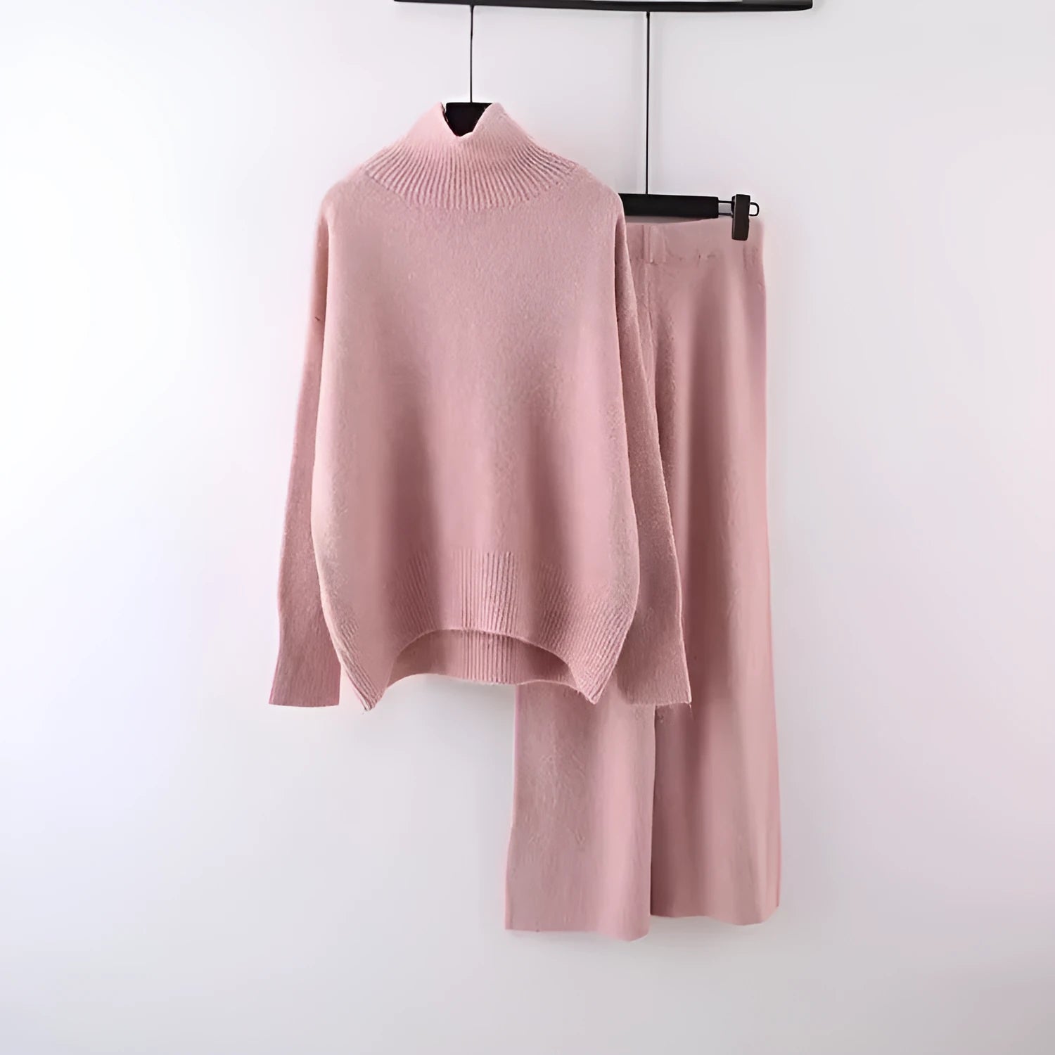 Women's casual two-piece set featuring a long-sleeve sweater and wide-leg trousers in a solid colour.