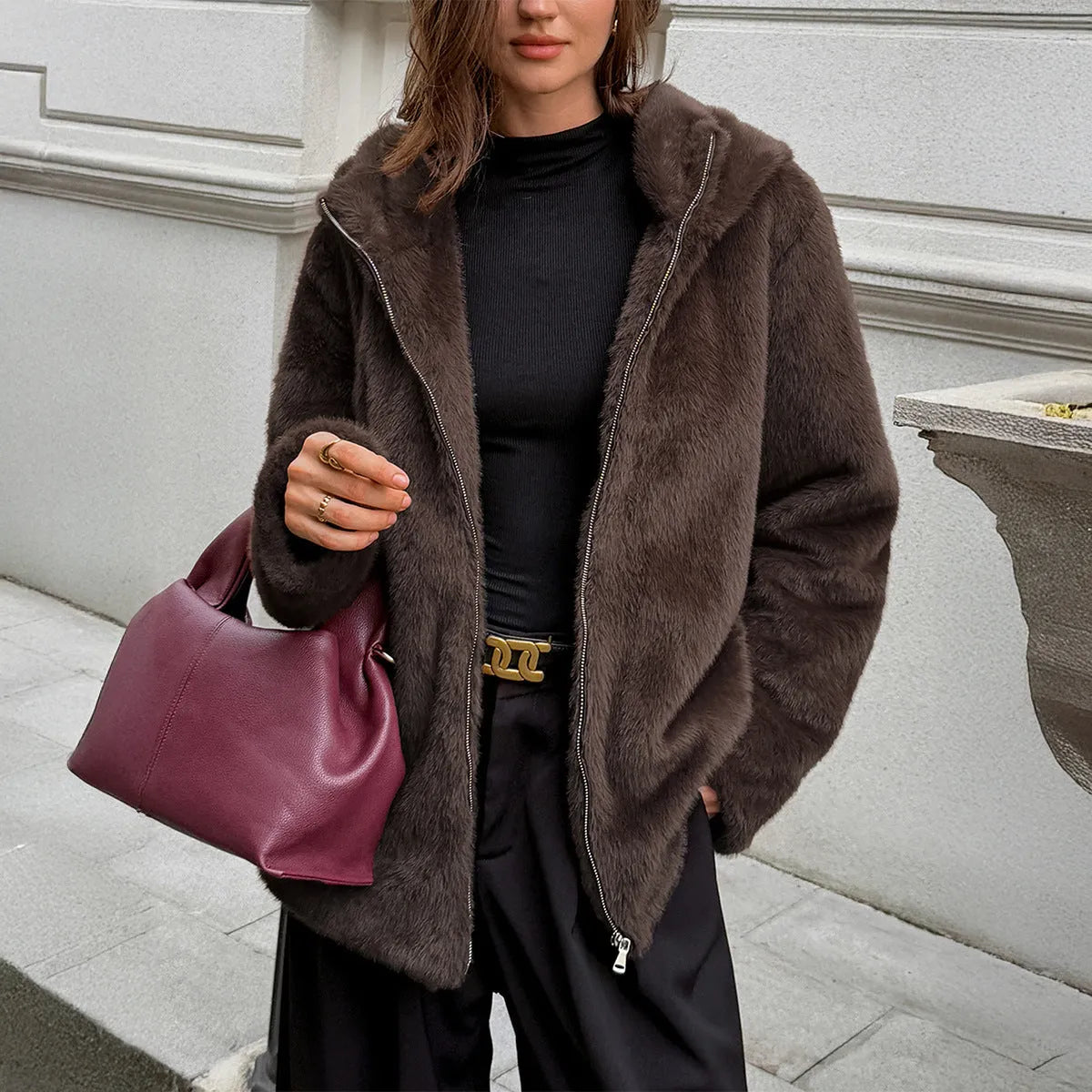 Women's brown polyester coat with fur collar, long sleeves, and regular fit on display