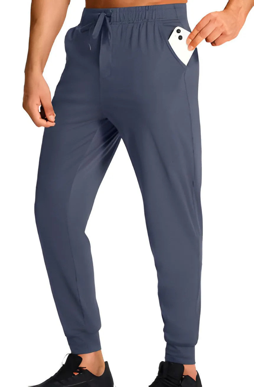 Man wearing loose-fit solid colour casual trousers in a leisure setting.