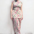 Women's long sleeve printed chiffon top paired with a high waist matching skirt.