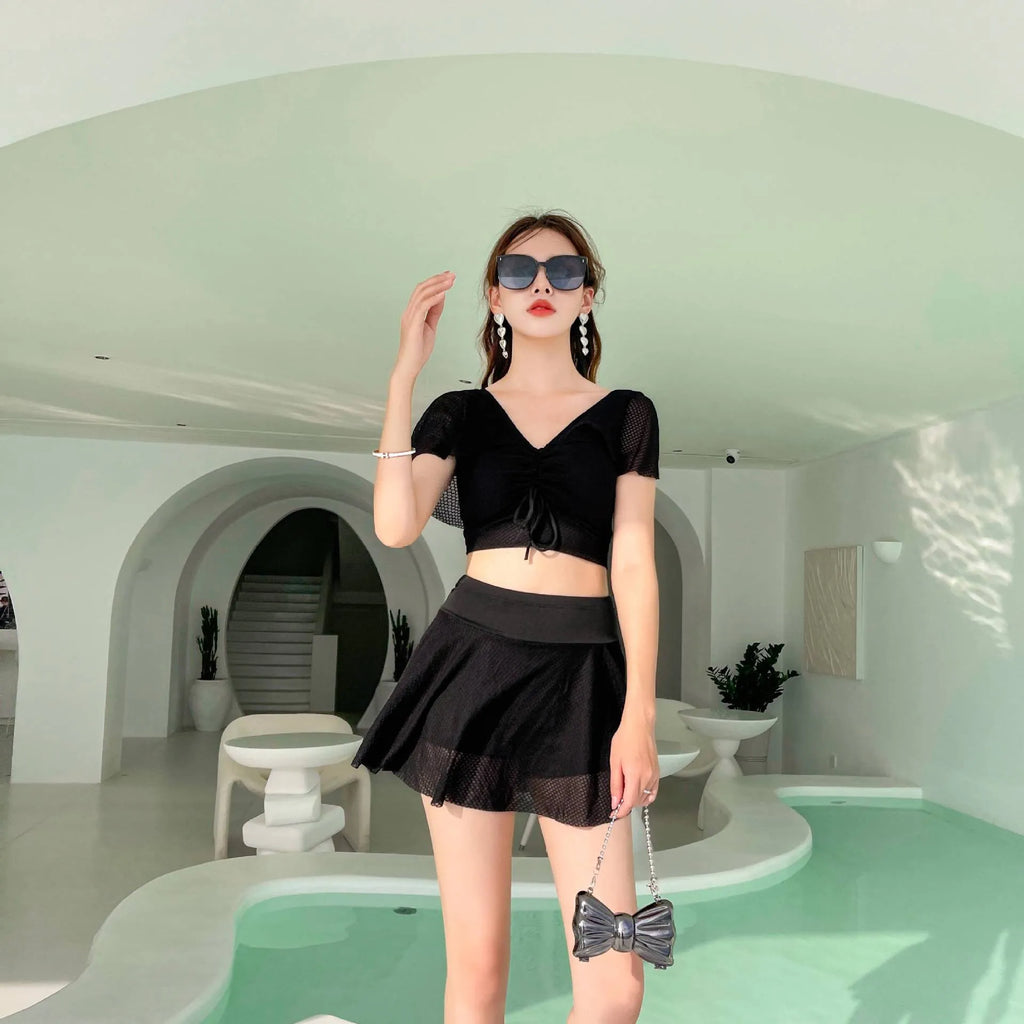 Women's solid colour two-piece skirt swimsuit set in black, white, or pink with separate top