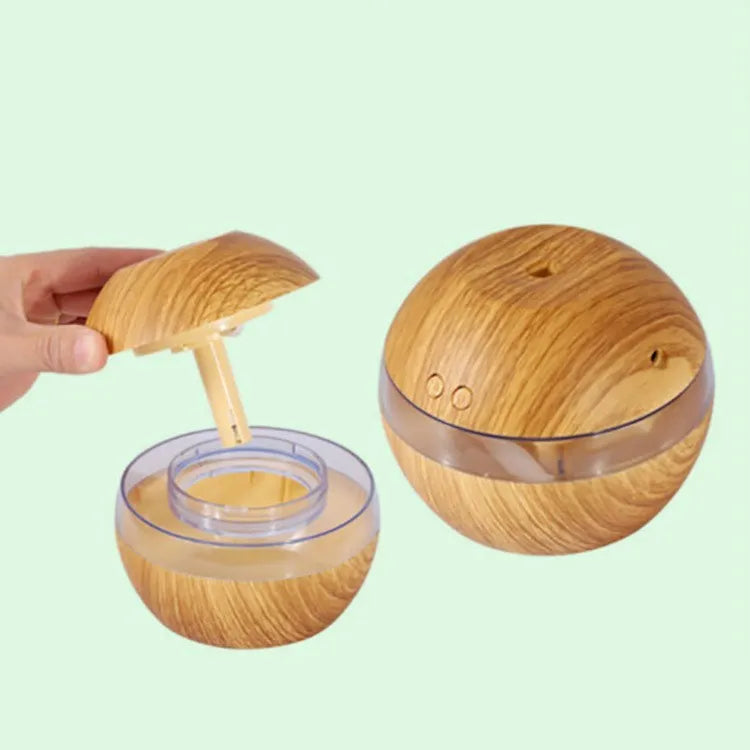 Brown wood grain USB humidifier with 200ml water tank showing adjustable mist control