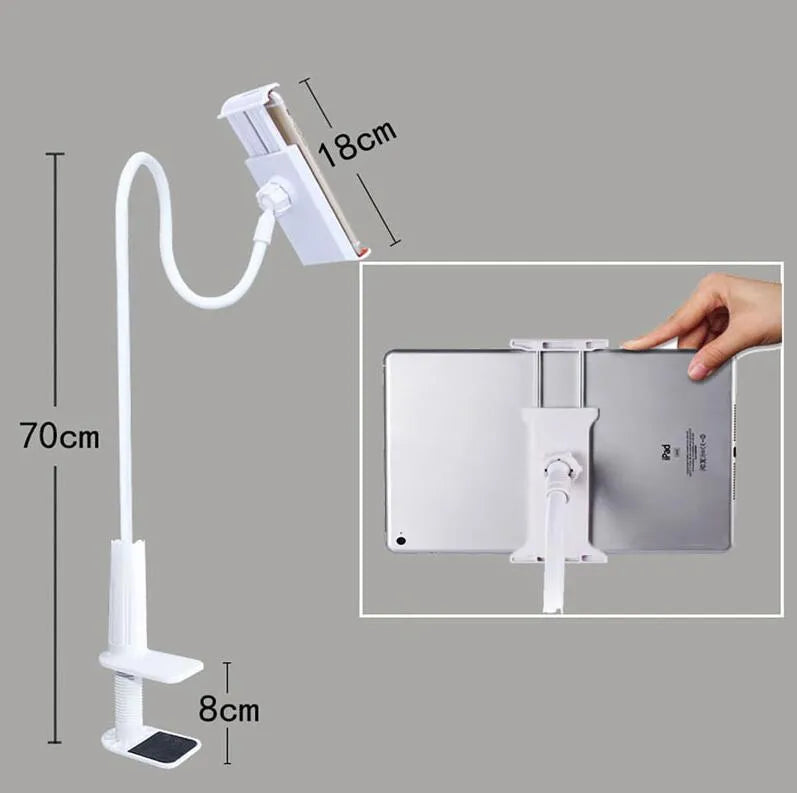 Black bedside phone handset with a long aluminium arm holding a mobile phone on a table.