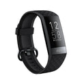 Black smart bracelet on wrist showing blood pressure and heart rate data on its 1.1-inch screen.