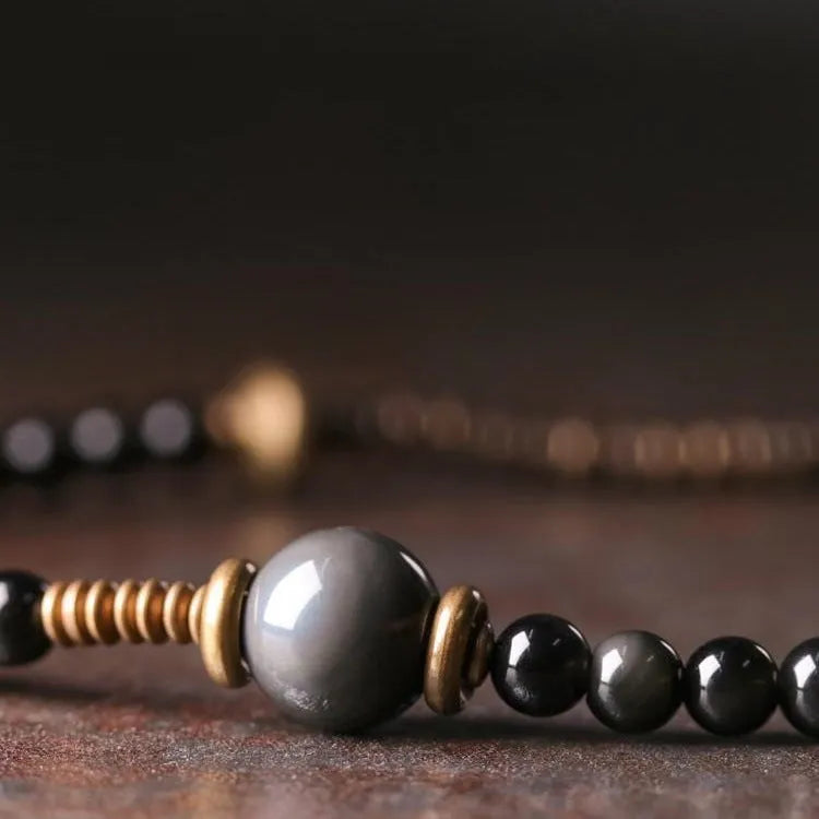 Black geometric beaded bracelet with multi-layered construction
