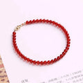 A classic style ultra-thin red agate bracelet for women on a white background.