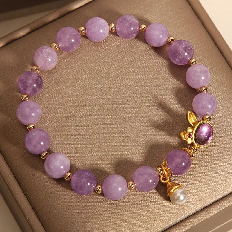 Natural mauve jade hare head crystal bracelet in Mori style with purplish red accents.