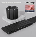 Silicone wrist weight bracelet with Velcro strap in black, blue, grey, or pink on a gym floor.