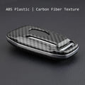 Black plastic protective shell for a car key fob with a buckle clip attachment.