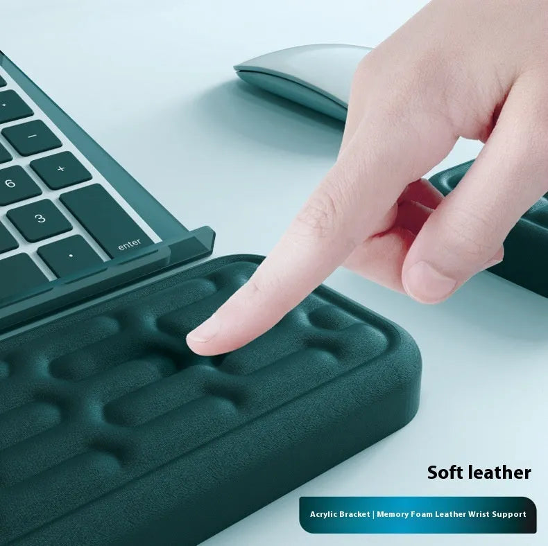 Double-sided keyboard and mouse pad with memory foam wrist rest on a resin base.