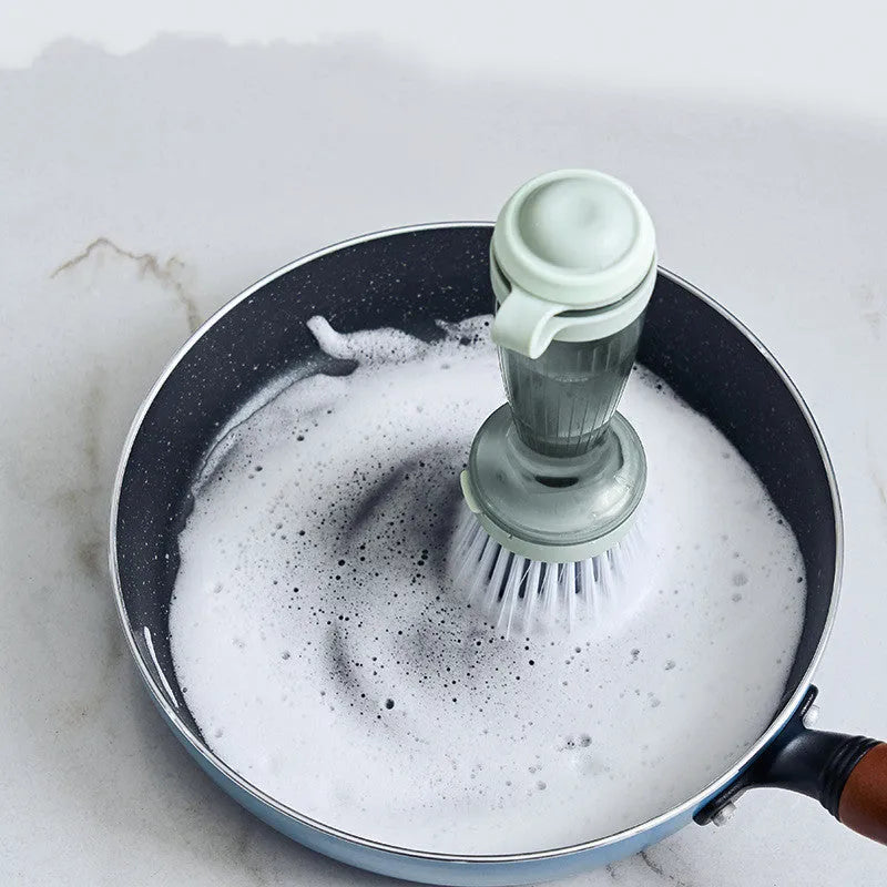 Milk white and mint green dish brush with soap dispenser in handle and non-scratch bristles