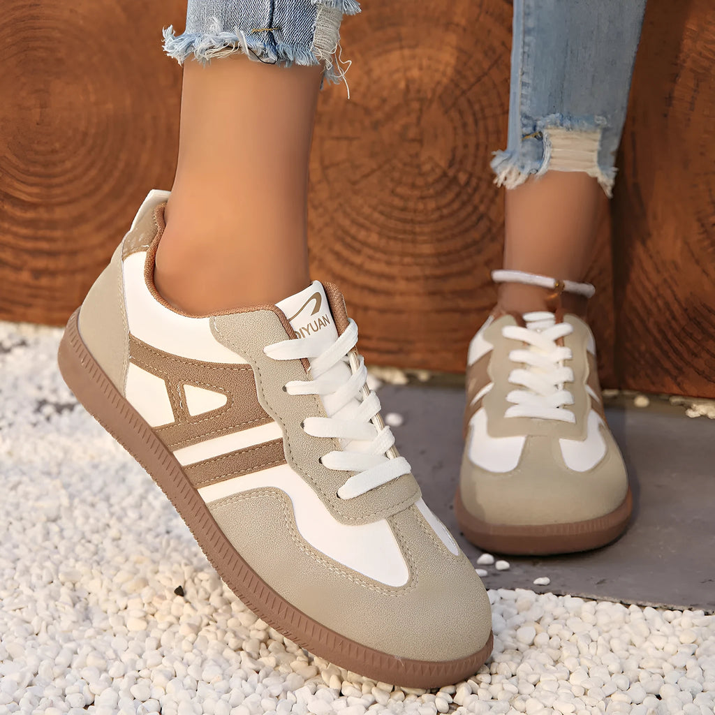 Women's low-top lace-up jogging shoes with a platform heel in khaki, grey, and black.