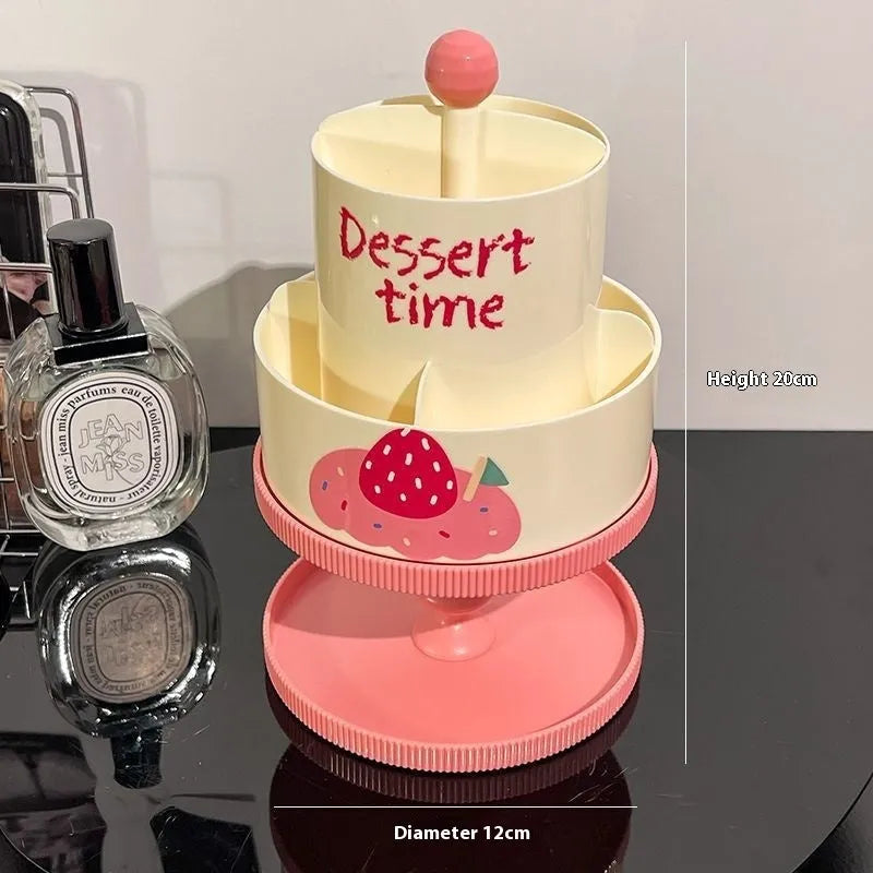 Rotating cosmetic brush storage barrel in a choice of colours on a table, showing its carousel design.