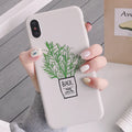 White silicone iPhone case with painted plant design showing 360-degree edge protection