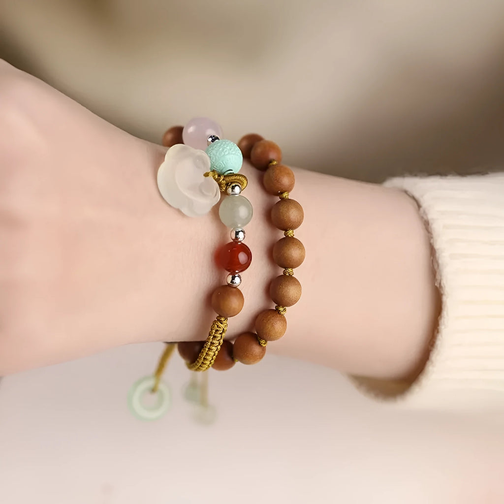 Hand-woven ebony bracelet with double ring design and traditional ruyi elements