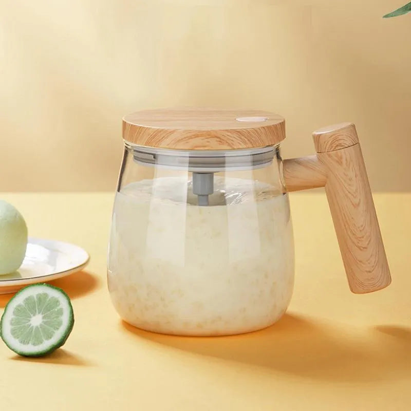 Clear borosilicate glass self-stirring coffee mug with electric base, 400ml capacity.