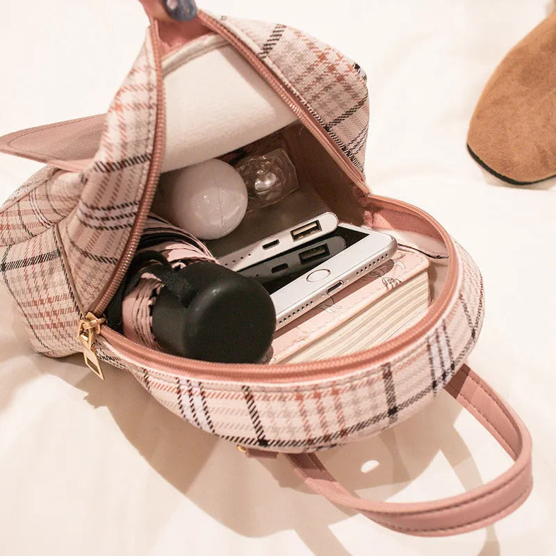 A one shoulder diagonal phone bag made of smooth PU fabric, shown in one of five available colours.