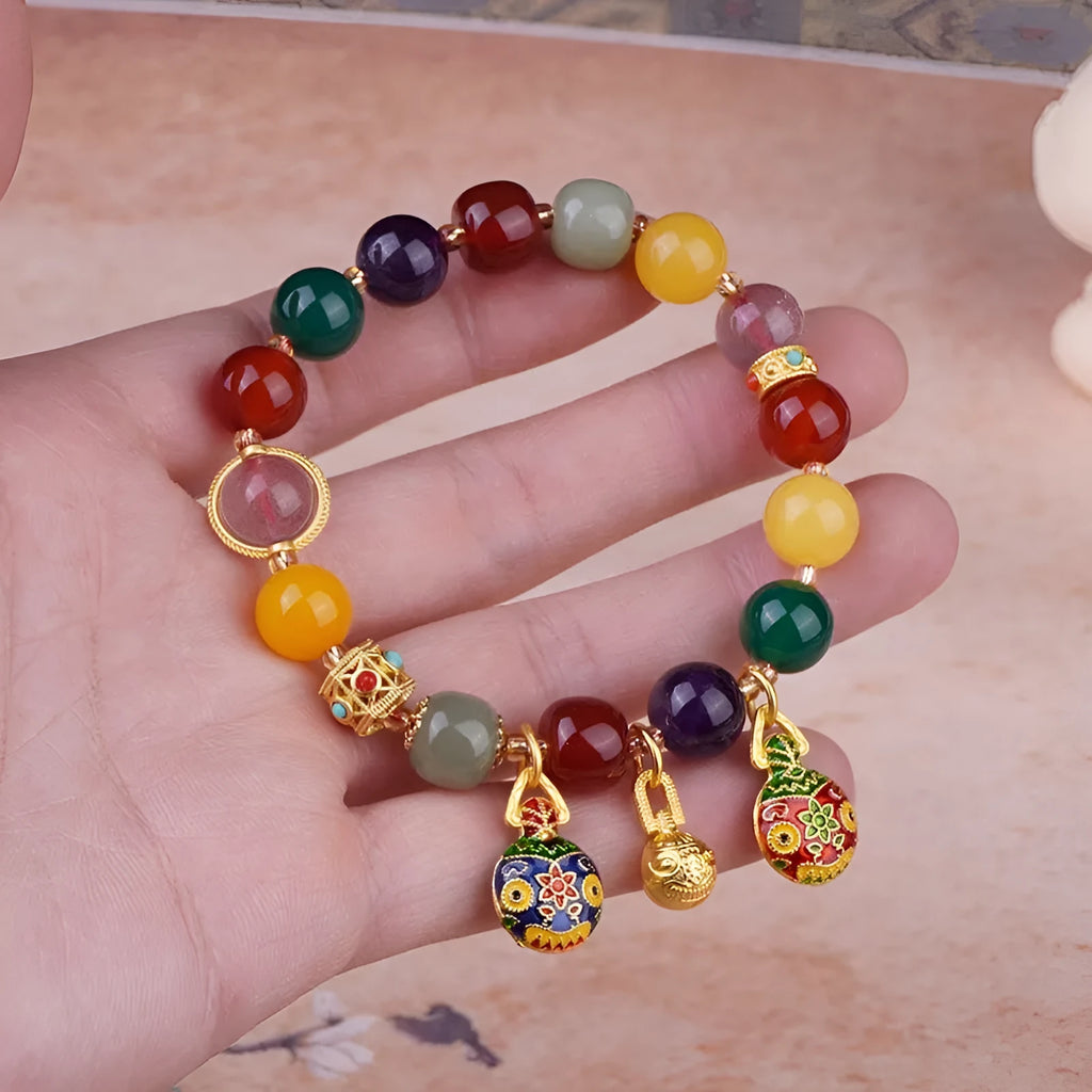 Hand-woven agate bracelet with gold and red Swallowing Gold Beast design on 10mm beads