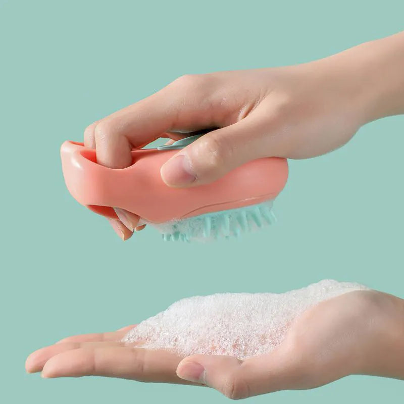 Multi-colour plastic pet bath brush with bristles on one side and a cat claw comb design on the reverse.