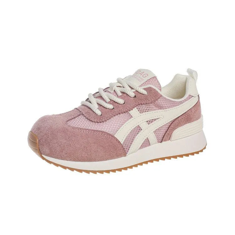 Women's white low-top lace-up sneakers with round toe on a flat plastic sole.