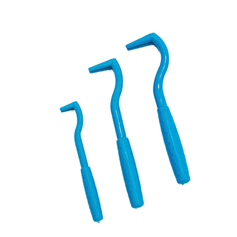 Three blue plastic pet tick removal clips with hook ends on a white background.
