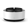 Grey intelligent electronic air purifier ashtray on a table with cigarette