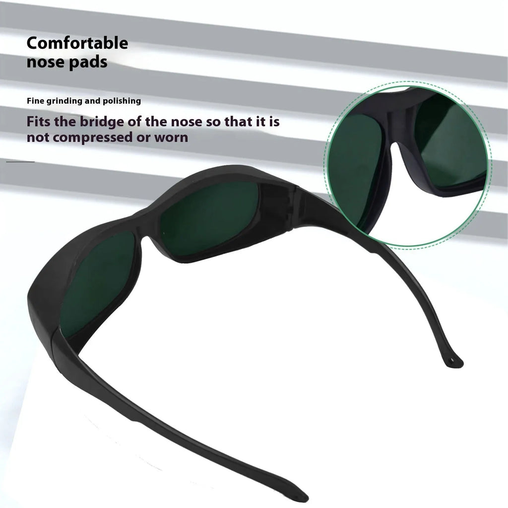 A pair of clear polycarbonate laser safety goggles for welding and skin treatment protection.