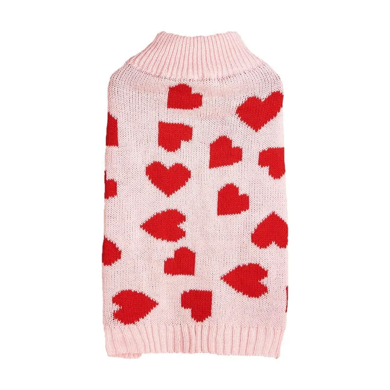 Red love heart design dog sweater on a small dog, showing acrylic knit and appliqué detail.