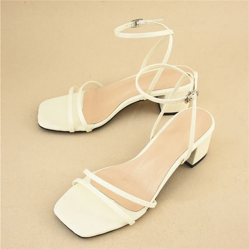 Beige women's stiletto sandals with chunky block heel and square toe design, showing adjustable ankle buckle closure