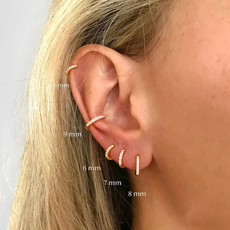 Zircon perforated stud earrings in gold, rose gold, or silver colour with geometric design